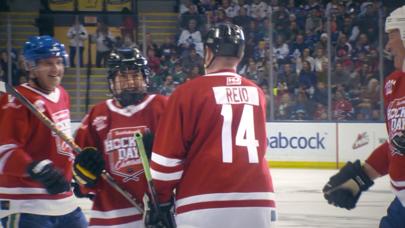 Ken Reid in a red jersey at an NHL arena, Hockey Day in Canada